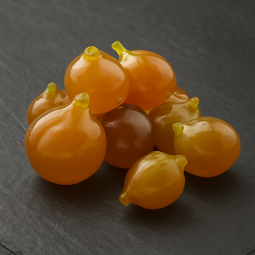 Hele gekonfijte vijgen met zachte textuur en zichtbare zaadjes op hoogwaardige leisteen