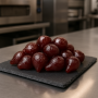 Small candied carmine pears with soft texture and deep red colour