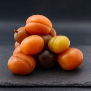 artisanal candied apricots from Provence, golden fruits on a slate board, authentic French delicacy