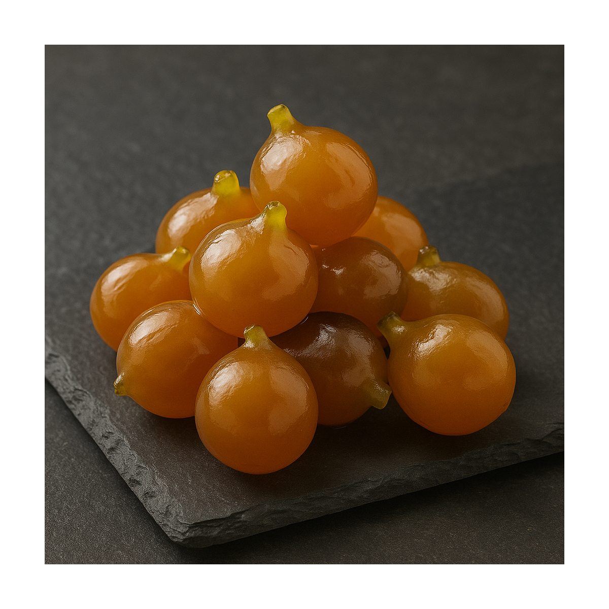 Artisanal candied figs arranged on high-end slate background