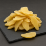 dried ginger slices on dark slate background