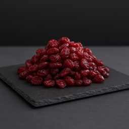 Dried cranberries on a dark slate board – premium dried fruits