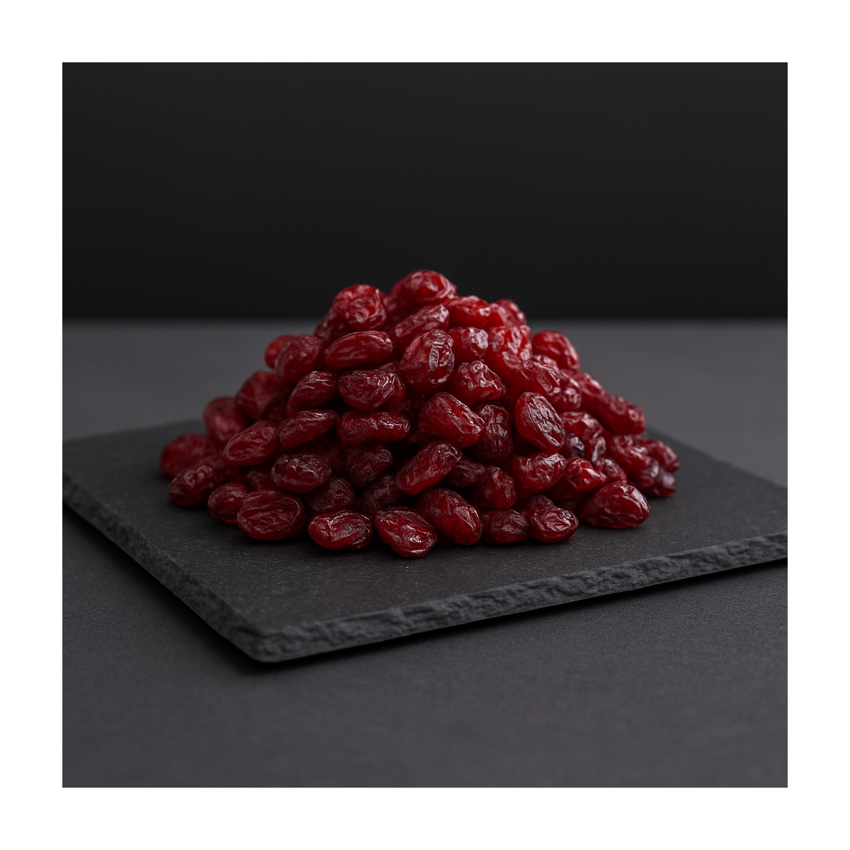 Dried cranberries on a dark slate board – premium dried fruits