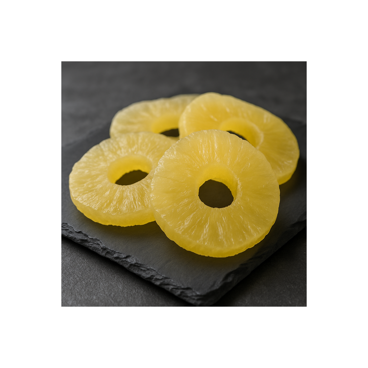 Dehydrated pineapple on premium slate board, top view, contemporary professional kitchen